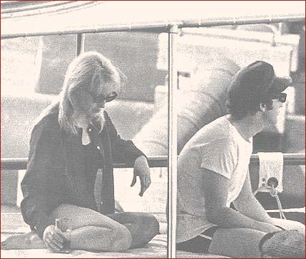 6: On the Boat #2: John Lennon and his wife, Cynthia (left), enjoy a quite, relaxing moment aboard a boat in Miami, February 1964. This was the first time America saw a Beatle dressed in something other than a suit while performing on stage. Despite being dressed in casual tee-shirt and swimming trunks, John Lennon is still wearing his trademark black leather cap.