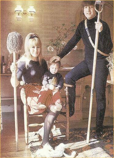 17: The King of Kenwood #1: John Lennon poses with his wife, Cynthia, and their young son, Julian, at their home in Kenwood in 1965. This is the first of the series of the Lord of the Manor style photos. Note that Cyn has a mop and John is holding a shovel.