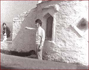 John Lennon on a remote location for the filming of Magical Mystery Tour.