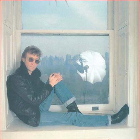 John Lennon sits in one of the windows of his Dakota home.