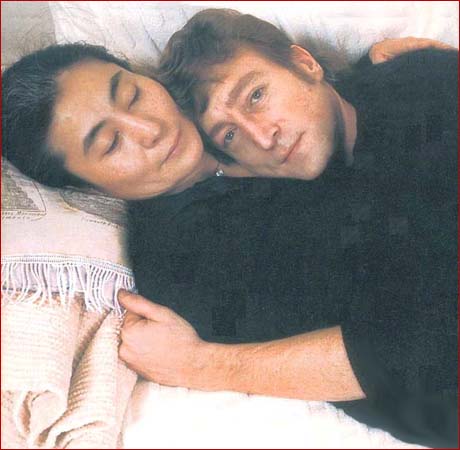 John Lennon and Yoko Ono pose intimately on December 8, 1980.